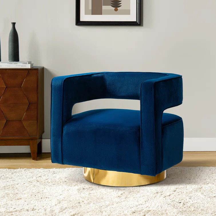 White upholstered armchair with a gold circular base sits on a round rug in a bright, modern living room.