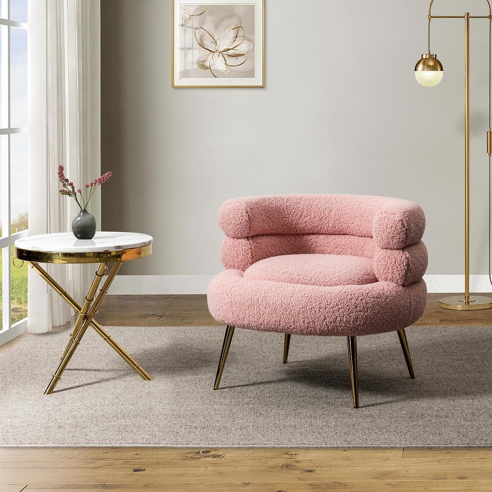 Cozy modern living room corner with a white boucle armchair, round marble side table, and gold floor lamp.